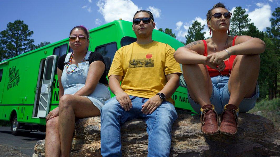 “Native Way Forward” roadtripper Isaac poses under an arbor. Part of the Hopi Tribe, Isaac hopes to start a nonprofit that provides social services to Native communities.